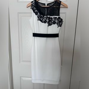Size 4 White with black lace dress. In perfect condition.